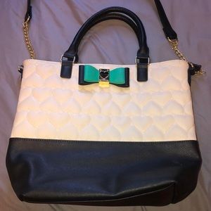 A black and white leather purse.
